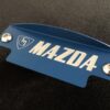 Blue M Mazda flywheel cover