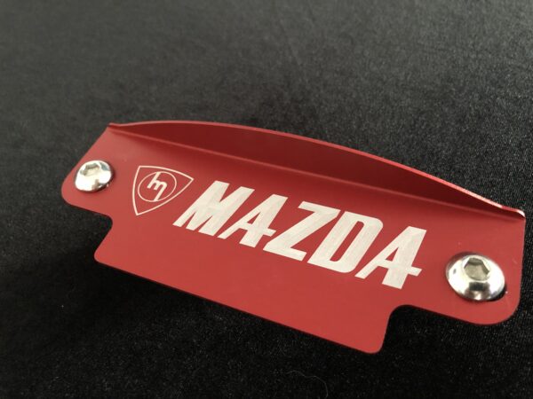 Red M Mazda fly wheel cover