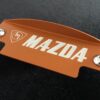 Orange m mazda flywheel cover