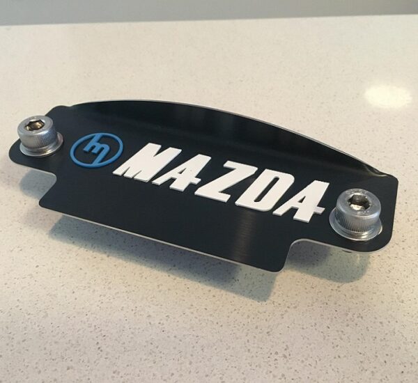 Blue M White Mazda black plate 12a cover