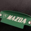 Green M mazda flywheel cover