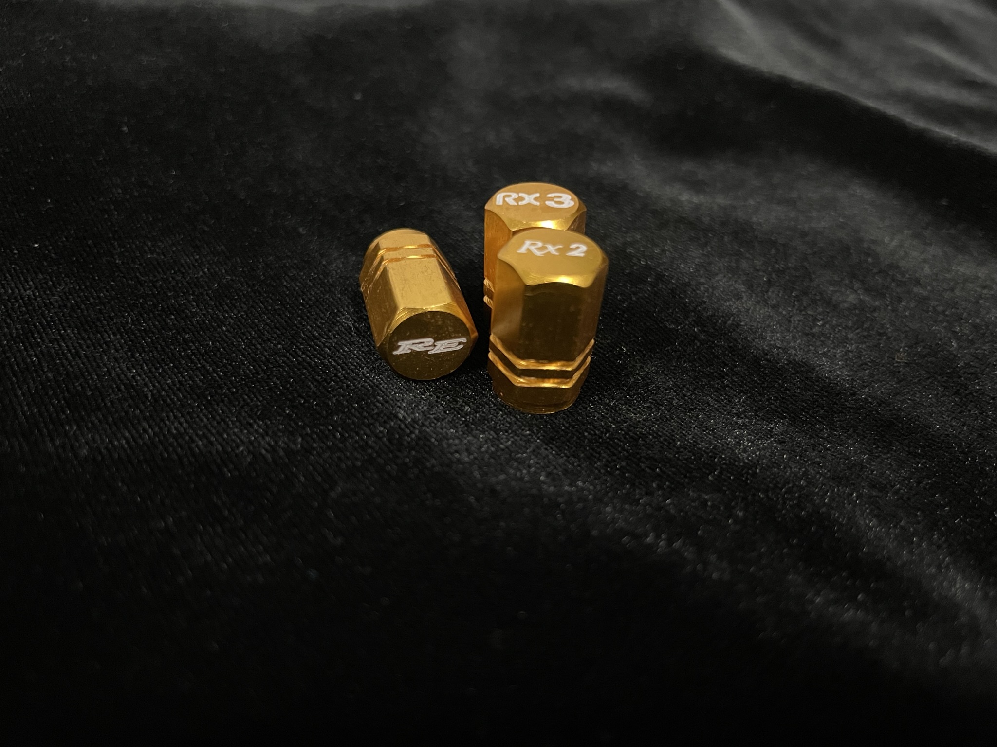 Gold Valve Caps RE logo