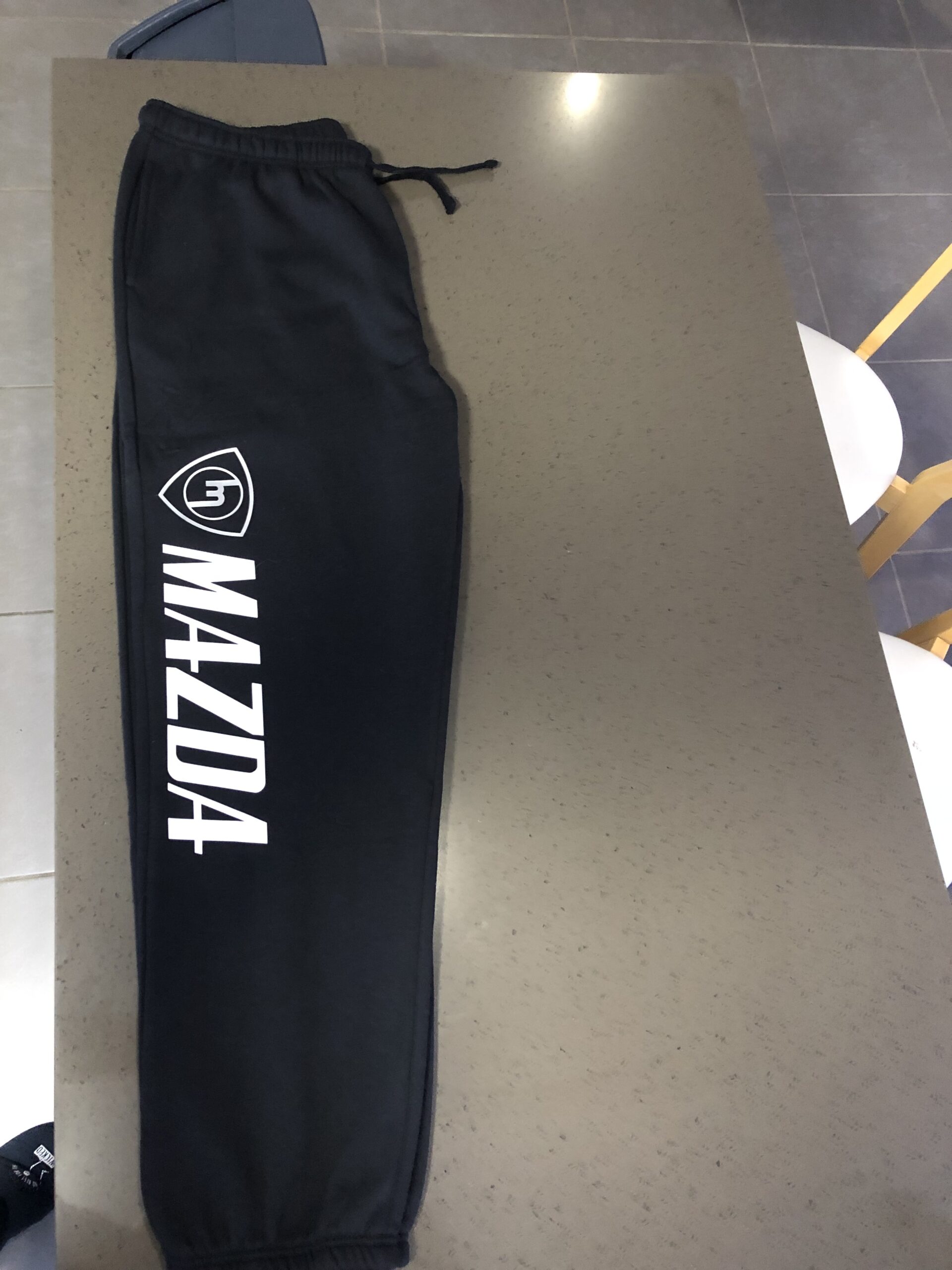 Black track pants with Silver M white Mazda