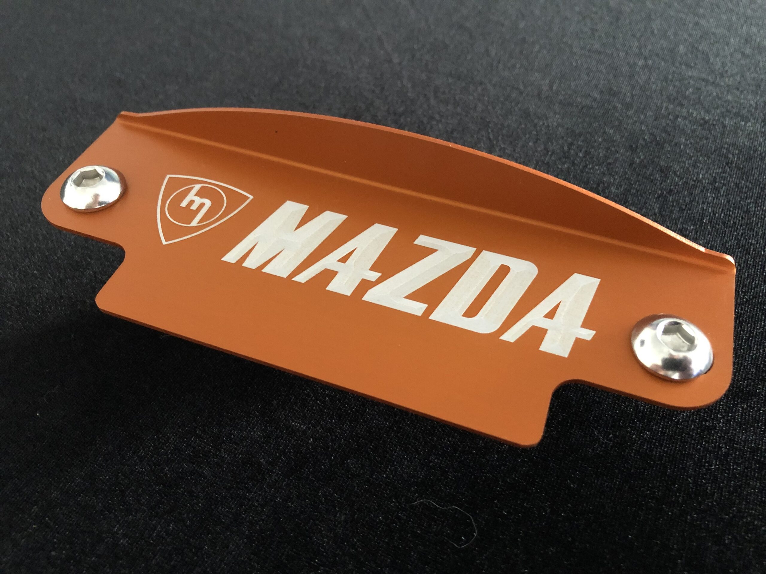 Orange m mazda flywheel cover