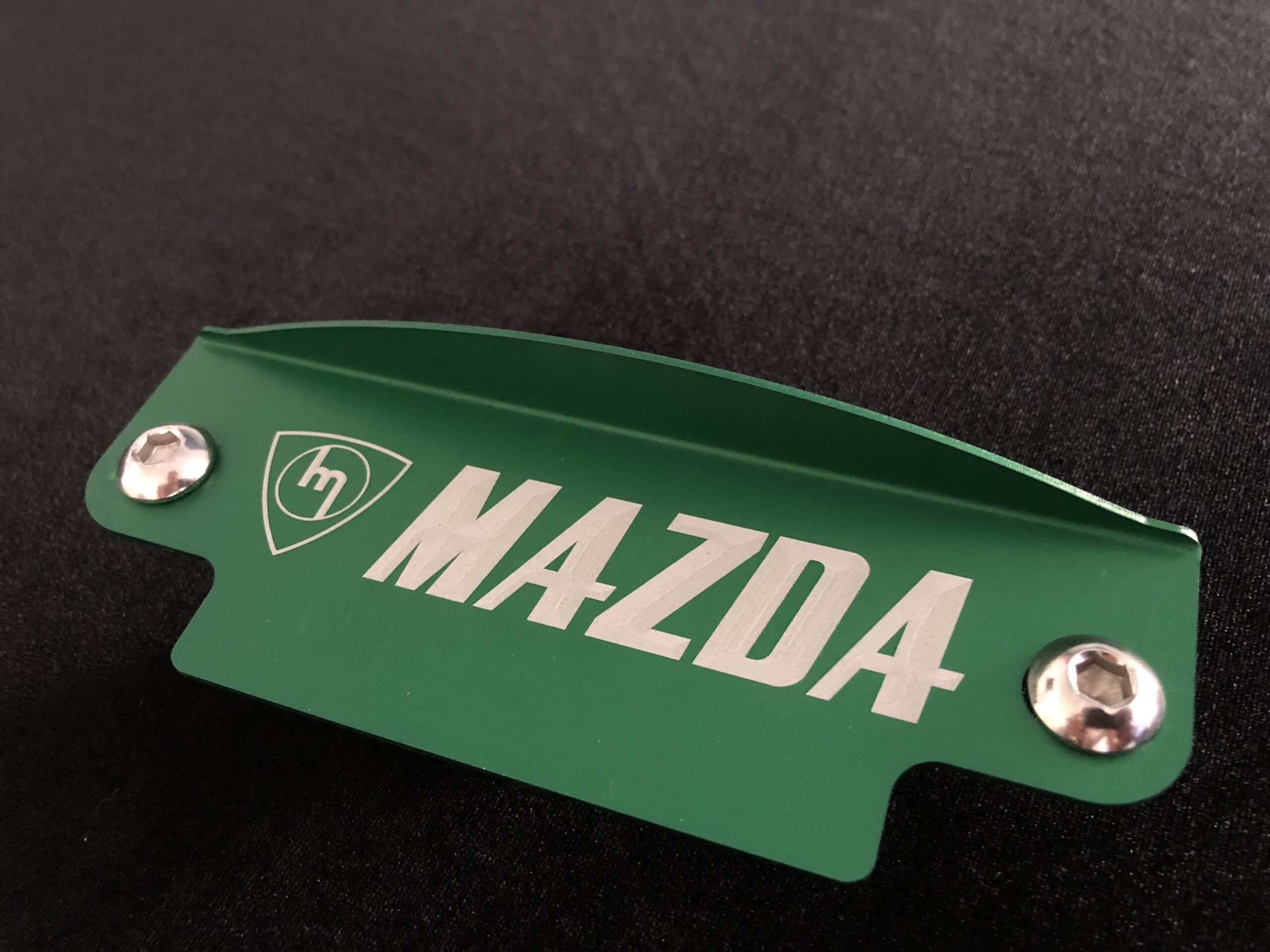 Green M mazda flywheel cover