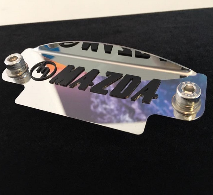 black M MAZDA raised 12a flywheel cover